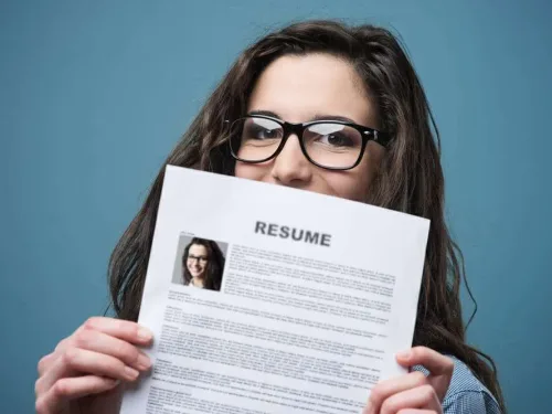 Young Woman Hiding Behind Her Resume